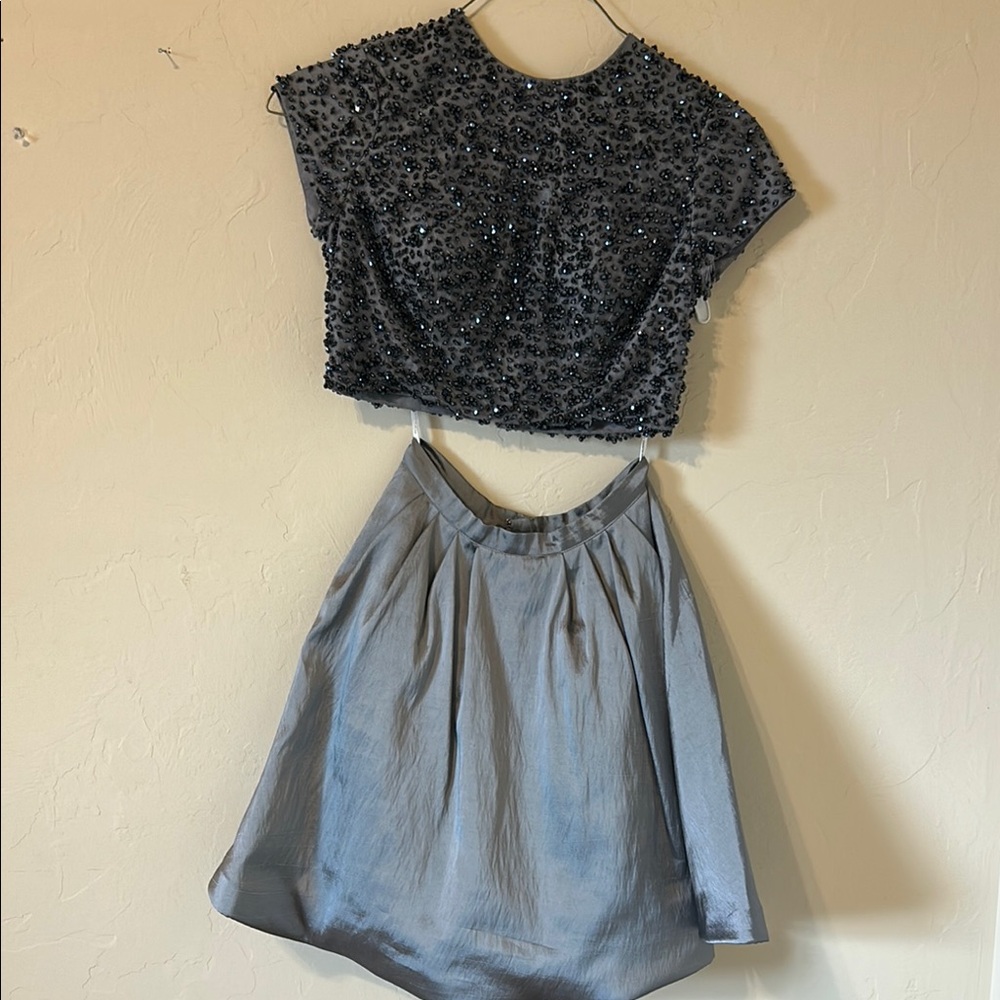 Sherri Hill beaded top with grey/ silver zippered skirt.
